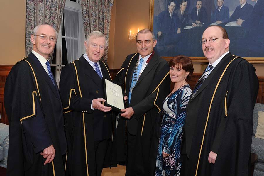 HMI President, Richie Dooley confers a Fellowship from the Institute on Denis Doherty, HMI Council Member and former President, at a ceremony in McKee Barracks. From left, Edward Byrne, HMI Honorary Secretary, Denis Doherty, HMI Council Member, Richie Dooley, HMI President, Lucy Nugent, HMI Council Member and Gerry O'Dwyer, HMI Director of Education - Picture -: Bobby Studio Archive.