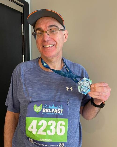 Prof. Donncha O’Brien, Consultant Neurosurgeon at Beaumont Hospital and Blackrock and Hermitage  Clinics in Dublin, who ran the 42nd Belfast Marathon to raise funds for Dublin and Cork Simon and Cork Penny Dinners. 